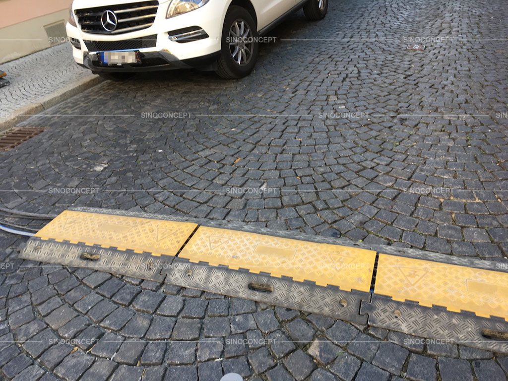 Used cable ramps installed across the road to protect cables