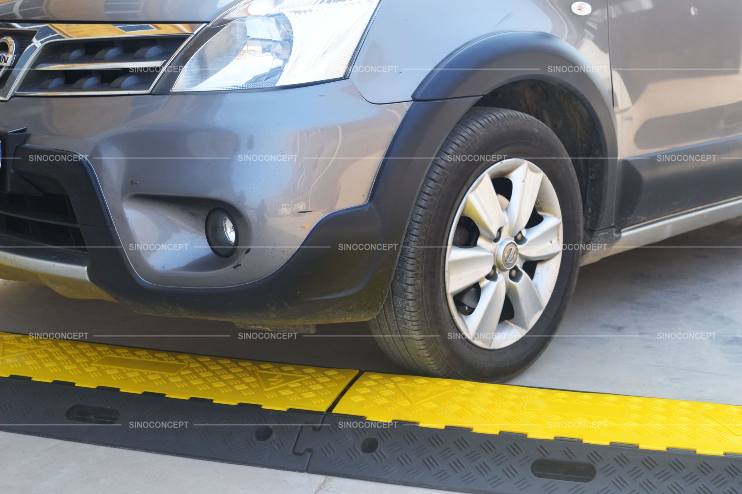 Rubber cable protectors coloured in yellow and black used to protect cables from vehicles